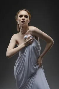 Serene Studio Atmosphere Drucke: A model elegantly poses, draped in a light fabric