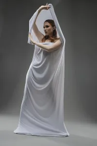 Female Model Studio Shot Drucke: A model gracefully interacts with draped white fabric