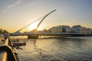 European Modern Architecture Style Drucke: Modern bridge over a river at sunset