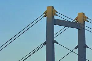 Evening Sunlight In Bavaria Drucke: A modern bridge at sunset with clear cable structures and a cloudless sky