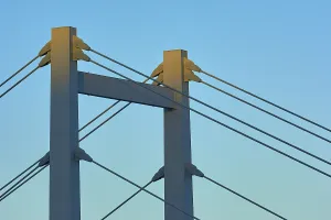 German Federal Republic Bridges Drucke: A modern bridge at sunset with clear cable structures and a cloudless sky
