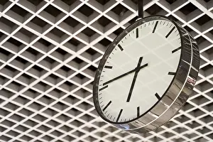 Black And White Architecture Drucke: Modern clock with dial on structured wall background in black and white with chrome