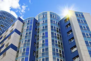 Urban Cityscape Drucke: Modern skyscraper on blue sky background