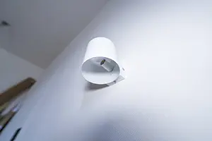 Empty Room Lighting Ideas Drucke: A modern white wall lamp on the wall