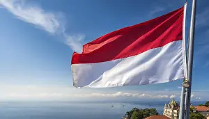 Monaco Flag Drucke: The Monaco flag flutters in the wind