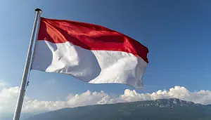 National Colours Blue And Red Drucke: The Monaco flag flutters in the wind