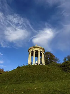 Central Europe Travel Image Drucke: Monopteros with autumn atmosphere and dynamic cloud structure