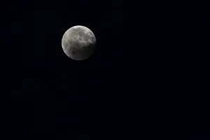 Bavaria Full Moon Drucke: Full moon at night, partially covered by a cloud