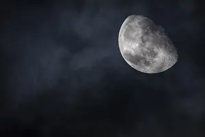 Cloudy Skies Of Austria Drucke: Moon in the night sky with clouds
