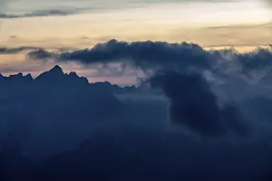 Cloudy Sky Italy Drucke: Mountain top of the Dolomites with dramatic cloudy sky