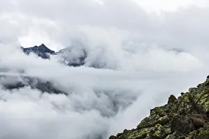 Austria Mountain Peaks Drucke: Mountain peak rises from clouds