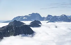 Overcast Sky Landscape Photo Drucke: Mountain peaks above the clouds