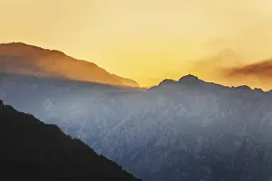 Colourful Evening Atmosphere Drucke: Mountain sunset and colored sky with clouds