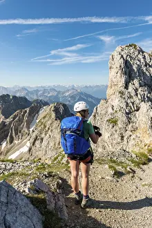 Karwendel Mountains Germany Drucke: Mountaineer with backpack looking over mountains