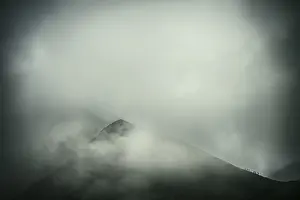 Alpine Sport In Europe Drucke: Mountaineer on mountain ridge with dramatic clouds