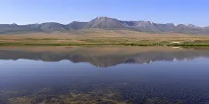 Kyrgyzstan Mountains Drucke: Mountains reflecting in a lake along the At-Bashy Range