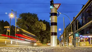 Road Safety In Europe Drucke: Moving trams at an intersection with a speed camera column