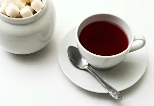 Empty Table Setting Still Life Drucke: Mug of tea and sugar on a light background