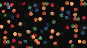 Dark Colored Background Art Drucke: Multicolored circles on a black background with blur abstract pattern