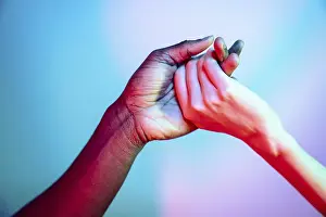 Vibrant Background Image Drucke: Multiethnic hands clasped together symbolizing unity and diversity