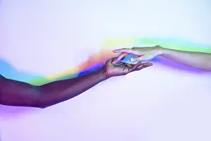 Multiethnic Unity Drucke: Two multiethnic hands reaching towards each other
