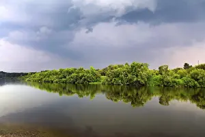 Stormy Weather Forecast Drucke: Nature Landscape with Small River and Dramatic Clouds