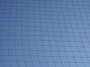 Blue Sky Texture Drucke: Net over blue sky texture background