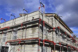 Single Family Home Construction Drucke: New building with completed basic rendering of the exterior facade New building with completed basic rendering of
