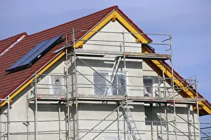 New Home Construction Process Drucke: New building with completed basic rendering of the exterior facade New building with completed basic rendering of