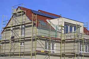 Residential Building Shell Construction Drucke: New building with completed basic rendering of the exterior facade New building with completed basic rendering of