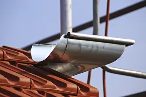 New Roof Construction Drucke: Newly installed gutter