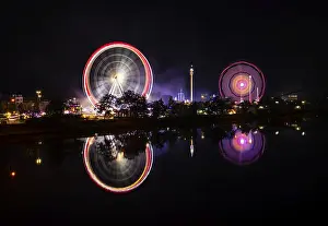 Southern Germany Fairground Ride Drucke: Night shot, overview, reflection in the river Neckar