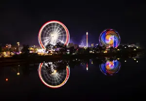 Southern Germany Fairground Scene Drucke: Night shot, overview, reflection in the river Neckar