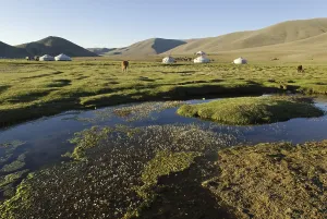 Deserted River Scenery Drucke: Nomadic yurts next to a river in the steppe