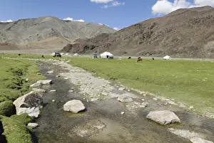 Deserted River Scenery Drucke: Nomadic yurts next to a river in the steppe