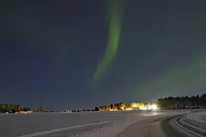 Aurora Borealis Europe Drucke: Northern lights over fields and a road
