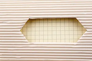 White Isolated Studio Photography Drucke: Notebook and a Cut out paper with pattern on a white background