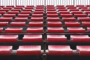 Deserted Stadium Drucke: Empty and numbered seats in a stadium