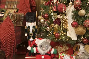 Decorative Items For The Festive Season Drucke: Nutcracker and christmas decorations around the tree