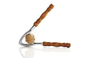 Studio Shot Of Nuts Drucke: Nutcracker with walnut