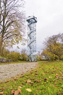European Autumn Scene Drucke: Observation tower next to a path surrounded by autumn trees