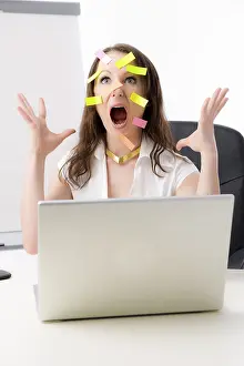 Office Worker Stress Drucke: Office worker with many post-its on her face