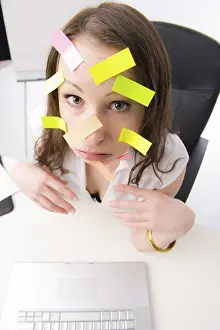 Office Worker Stress Drucke: Office worker with many post-its on her face