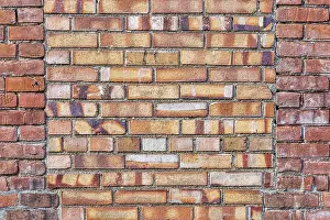 Brick Wall Background Image Drucke: Old brick wall background texture with a window covered by different bricks