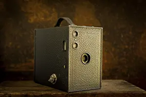 Brown Background Still Life Drucke: Old camera on brown background