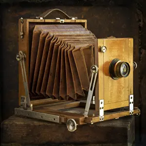 Brown Background Still Life Drucke: Old camera on brown background