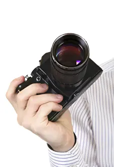 White Background Photography Drucke: Old Camera in a Hand Isolated on the White Background