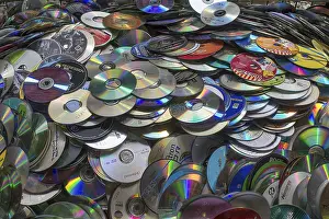 Waste Separation In Europe Drucke: Old CD's collected for recycling in a container