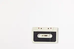 Isolated Audio Equipment Drucke: Old compact cassette on white background