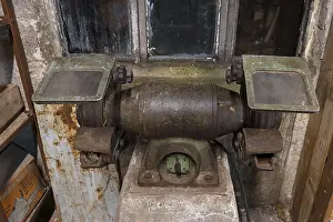 GDR History Drucke: Old grinding machine in a former LPG workshop in the GDR
